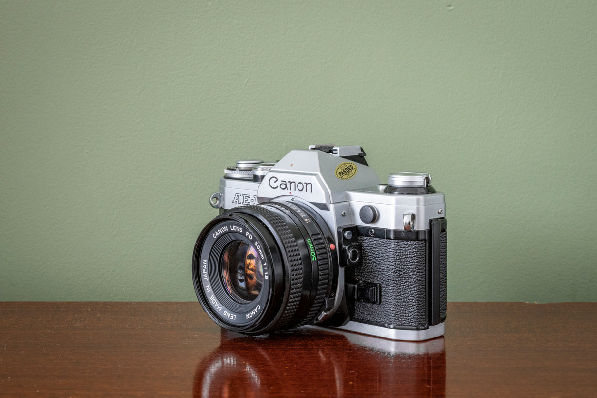Gorgeous Canon AE1 35mm SLR Film Camera + Canon 50mm F1.8 FD Lens - Silver