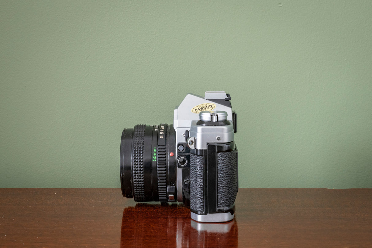 Gorgeous Canon AE1 35mm SLR Film Camera + Canon 50mm F1.8 FD Lens - Silver