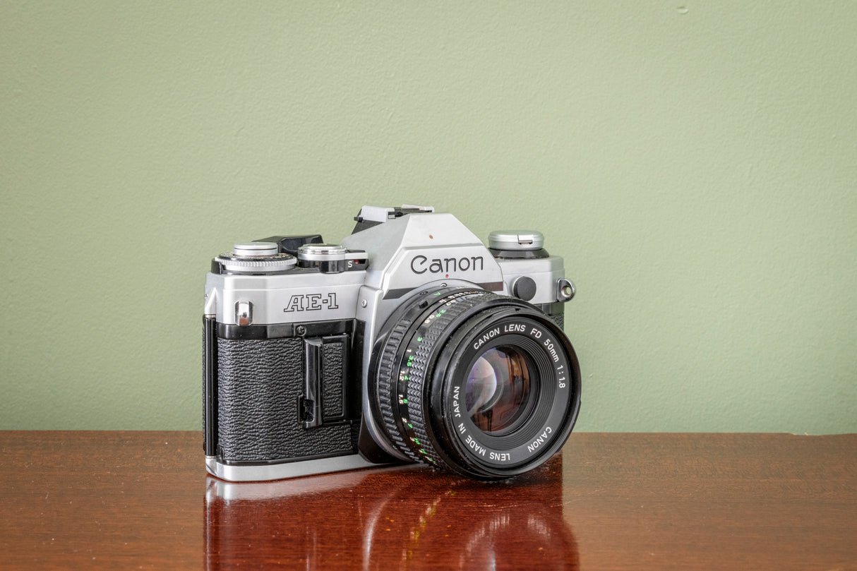 Gorgeous Canon AE1 35mm SLR Film Camera + Canon 50mm F1.8 FD Lens - Silver