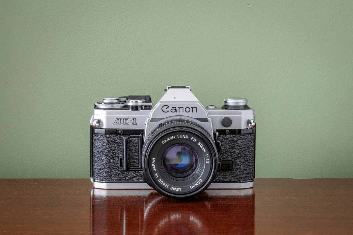 Gorgeous Canon AE1 35mm SLR Film Camera + Canon 50mm F1.8 FD Lens - Silver